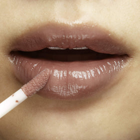 100% PURE Lip Gloss easy glide application for quick touch-ups.