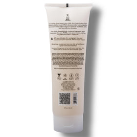 Product display of 100% PURE Coconut Milk Restorative Shampoo for color-treated hair