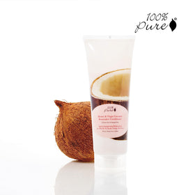 Creamy conditioner being applied to hair for deep conditioning.