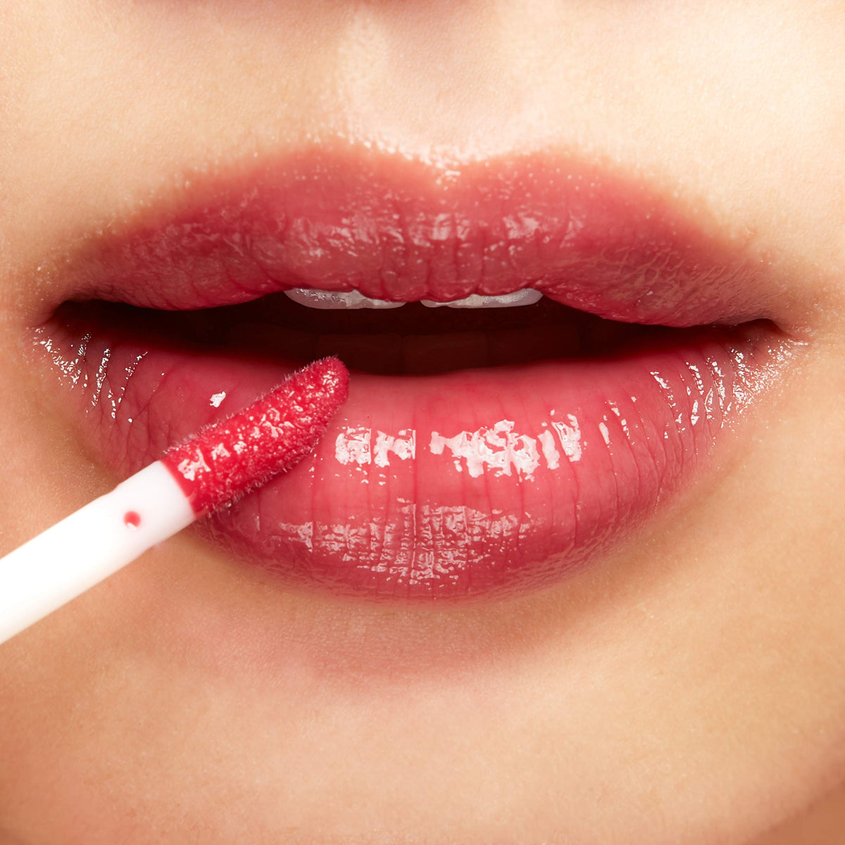 100% PURE Lip Gloss Pomegranate Wine demonstrates vegan and cruelty-free formulation.