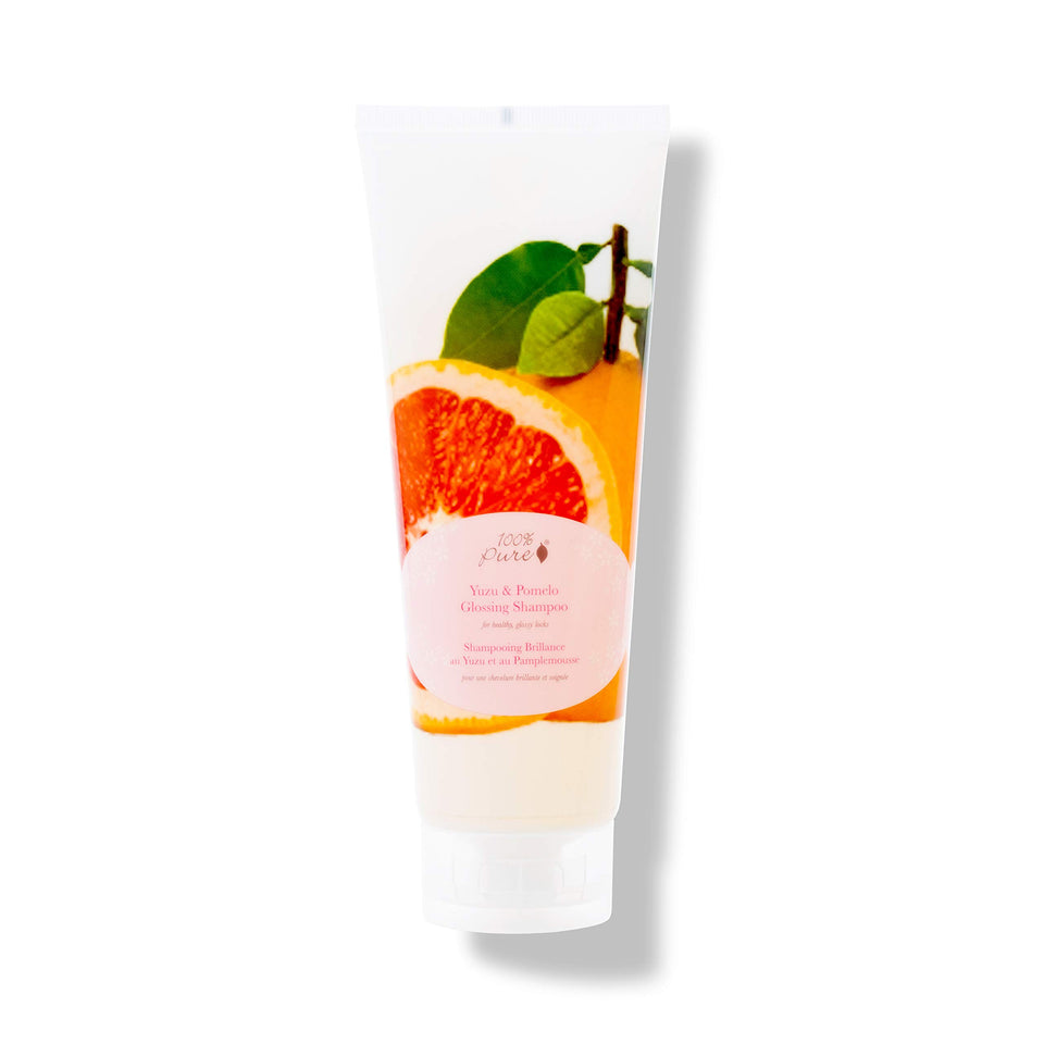 100% PURE Yuzu & Pomelo Glossing Shampoo bottle delivering citrus-bright shine for dull hair.