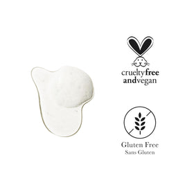 100% PURE Yuzu & Pomelo Glossing Shampoo bottle on vanity emphasizing color-safe hydration.