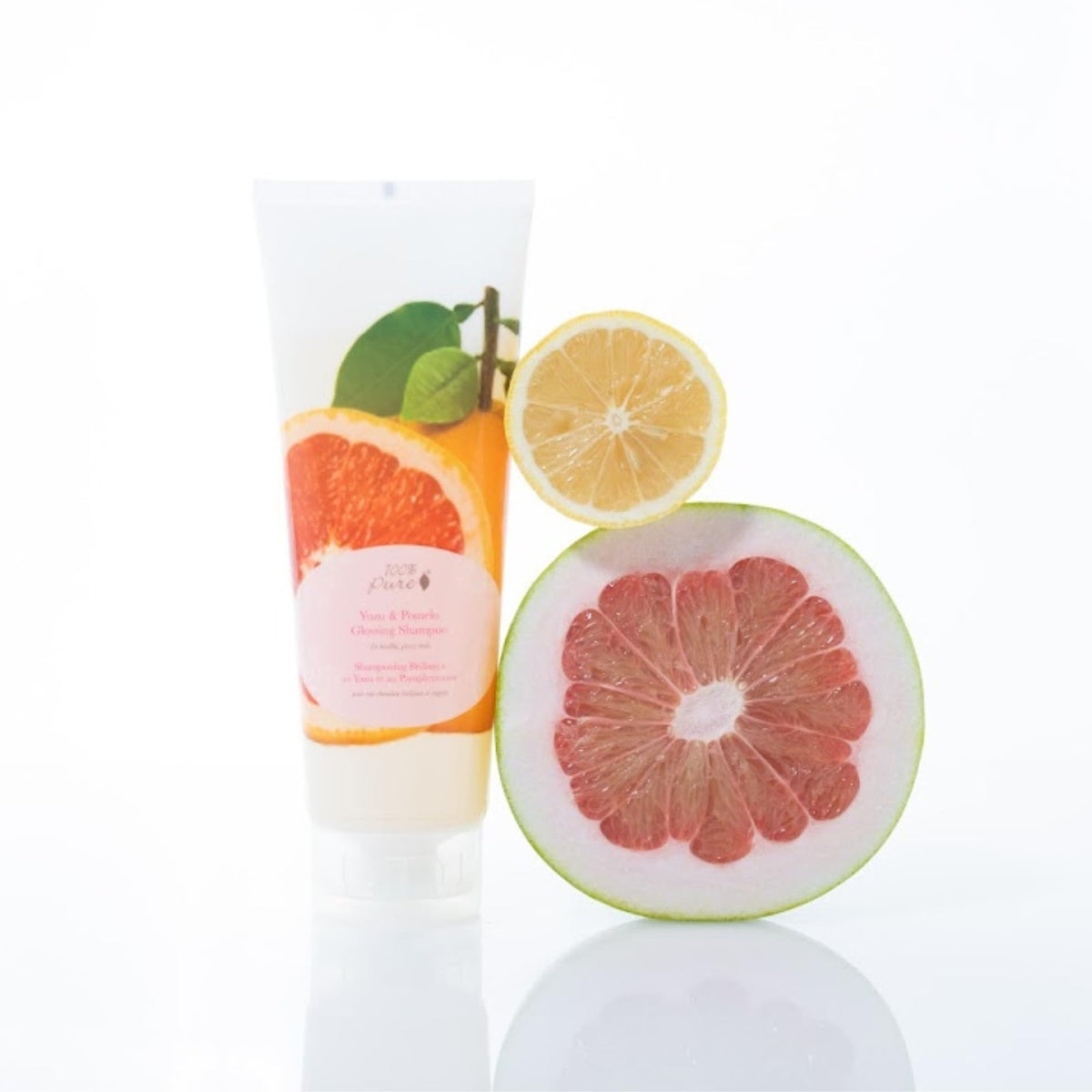 Hair massaged with 100% PURE Yuzu & Pomelo Glossing Shampoo for gentle cleansing.