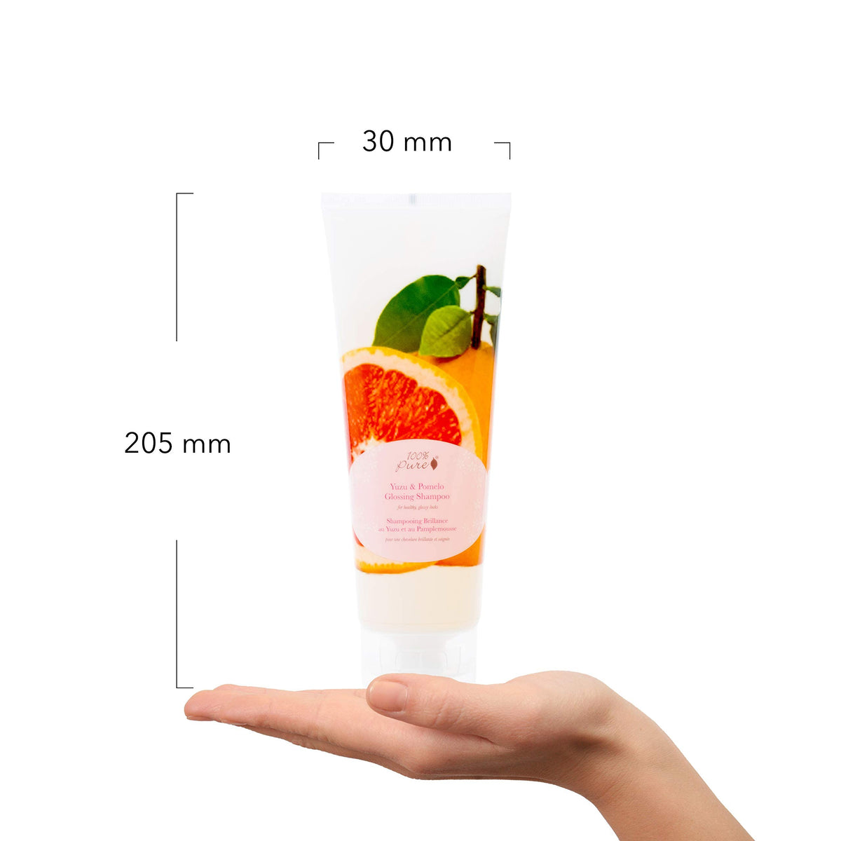 Packaging of 100% PURE Yuzu & Pomelo Glossing Shampoo signals vegan, cruelty-free formula.