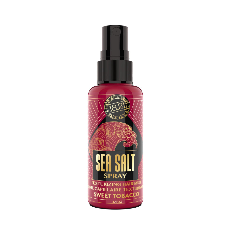 18.21 Man Made Sea Salt Spray bottle pour for textured, beach-ready hair.