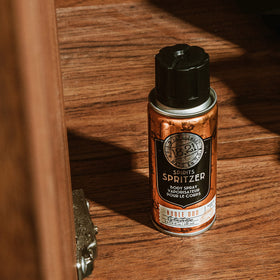 1821 Man Made Noble Oud Spirit Spritzer hands applying spray, quick scent reset.