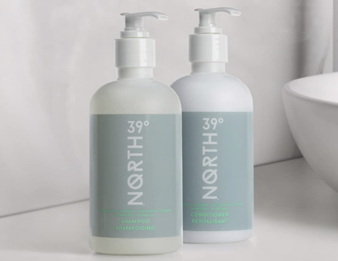 Shampoo and conditioner set displayed on sink for easy at-home routine