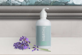 Pouring 39north conditioner from bottle for smooth, manageable hair.