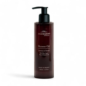 A LA MAISON Cleansing Shower Oil Jasmine and Santal bottle showing hydrating daily cleanse benefits.
