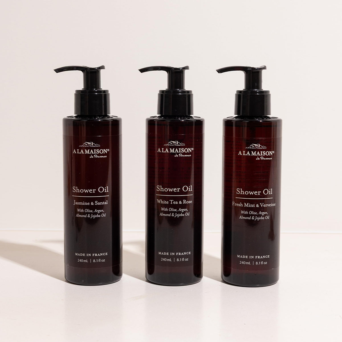 A LA MAISON Cleansing Shower Oil sustainable bottle emphasizing recycled plastic.