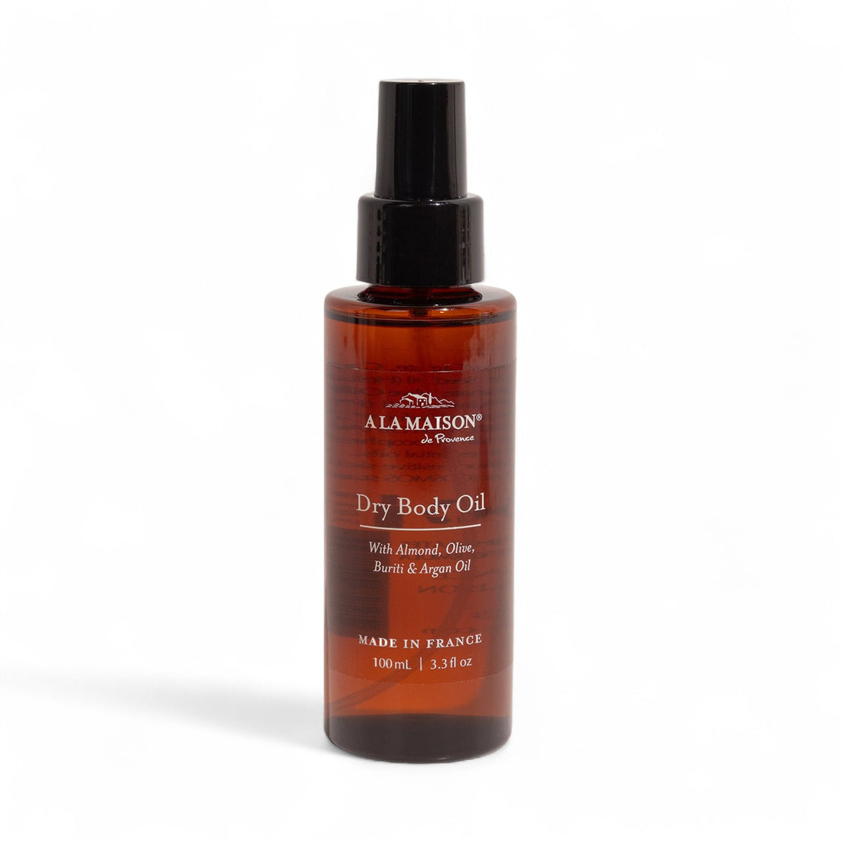 A LA MAISON Dry Body Oil Spray bottle closeup showing weightless hydration.