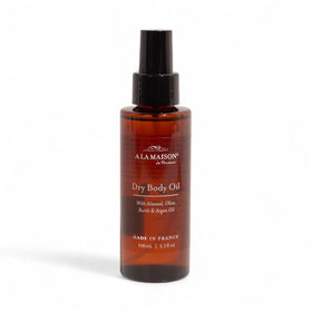 A LA MAISON Dry Body Oil Spray bottle closeup showing weightless hydration.