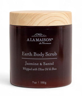 A LA MAISON Earth Body Scrub Amber Collection jar shows gentle exfoliation and moisturizing oils.