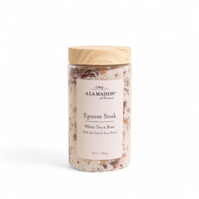 A LA MAISON Epsom Salt Bath Soak bottle with White Tea & Rose promotes calm during spa ritual