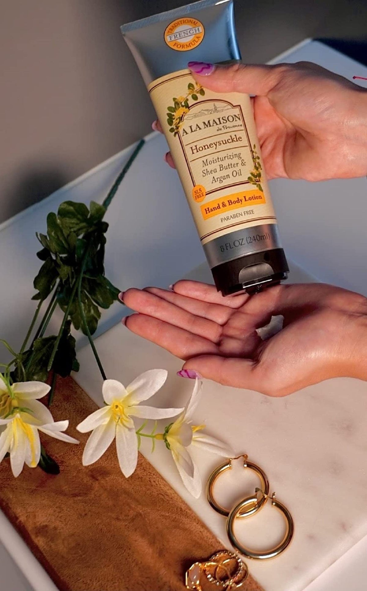 Creamy texture of A LA MAISON Honeysuckle lotion close-up