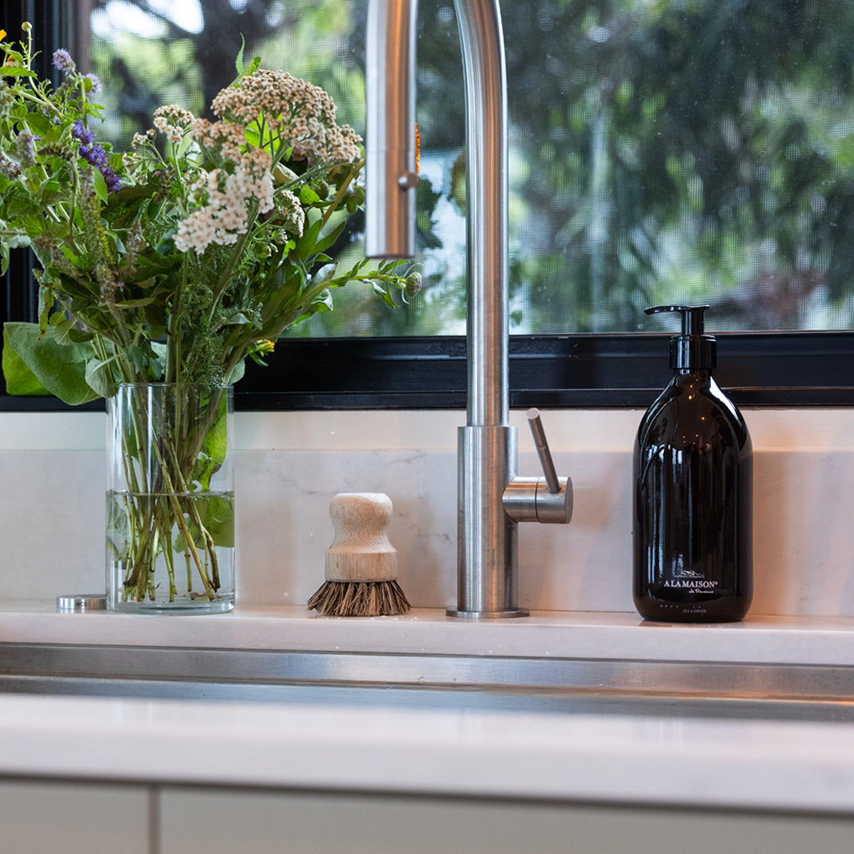 A LA MAISON vegan-biodegradable formula highlights eco-friendly hand care.