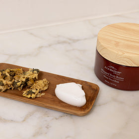 A LA MAISON hand application shows creamy texture sinking in.