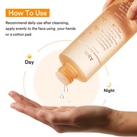 Abib Glutathiosome Dark Spot Toner bottle beside natural ingredients suggesting gentle brightening