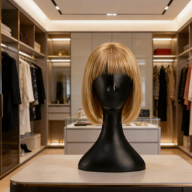 Acshio lightweight plastic wig head is easy to move between stations.
