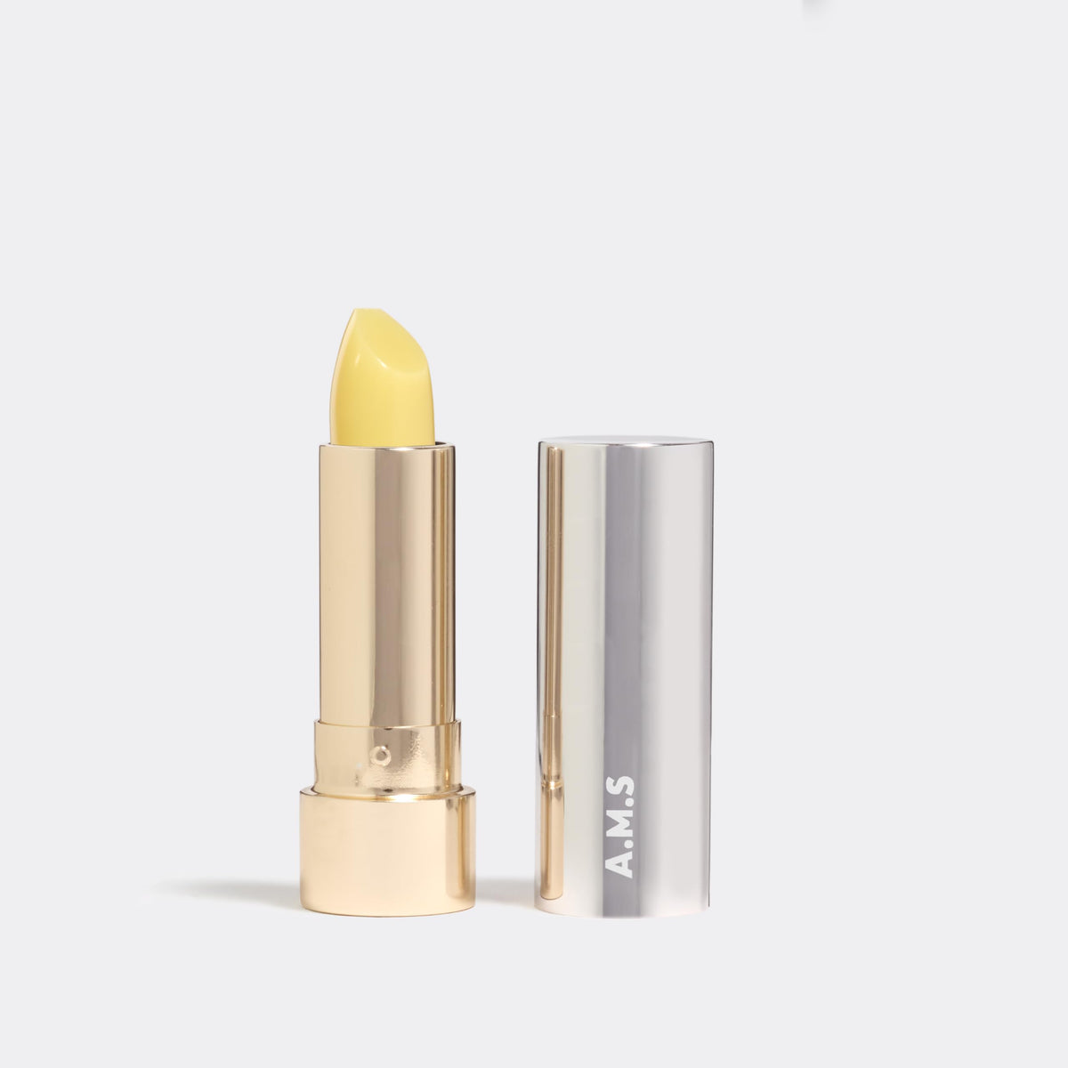 Applying ACTIVIST lip balm for daily moisture and nourishment.