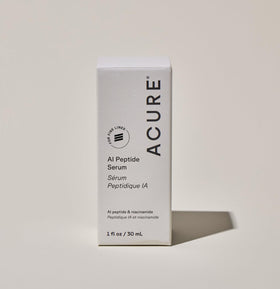 Acure AI Peptide Serum close-up of ingredients list and texture.