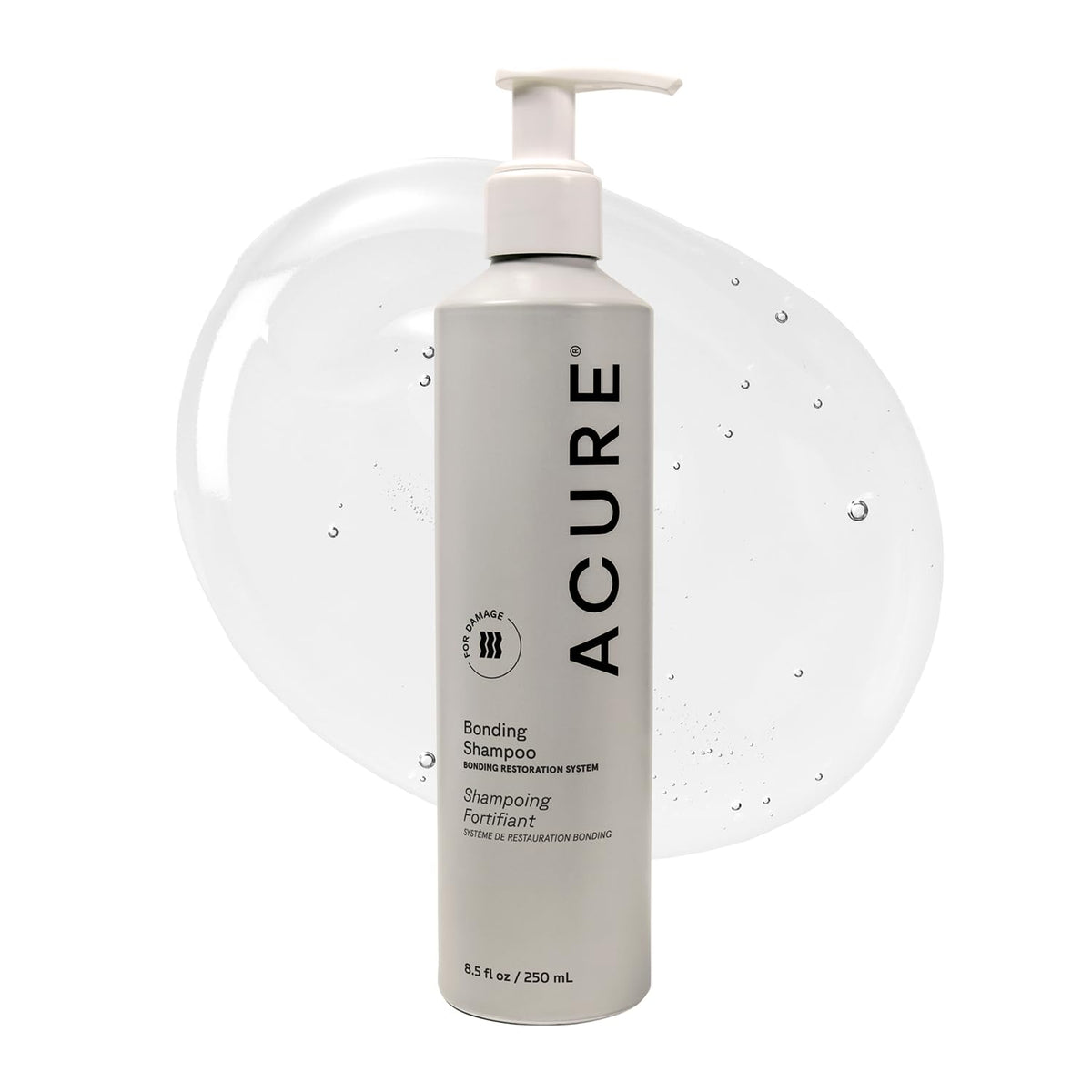 Acure Bonding Shampoo bottle on counter for daily cleansing of dry hair.