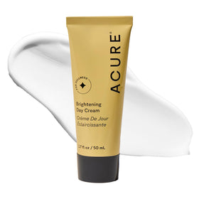 Acure Brightening Day Cream jar closeup showing creamy texture for daily hydration