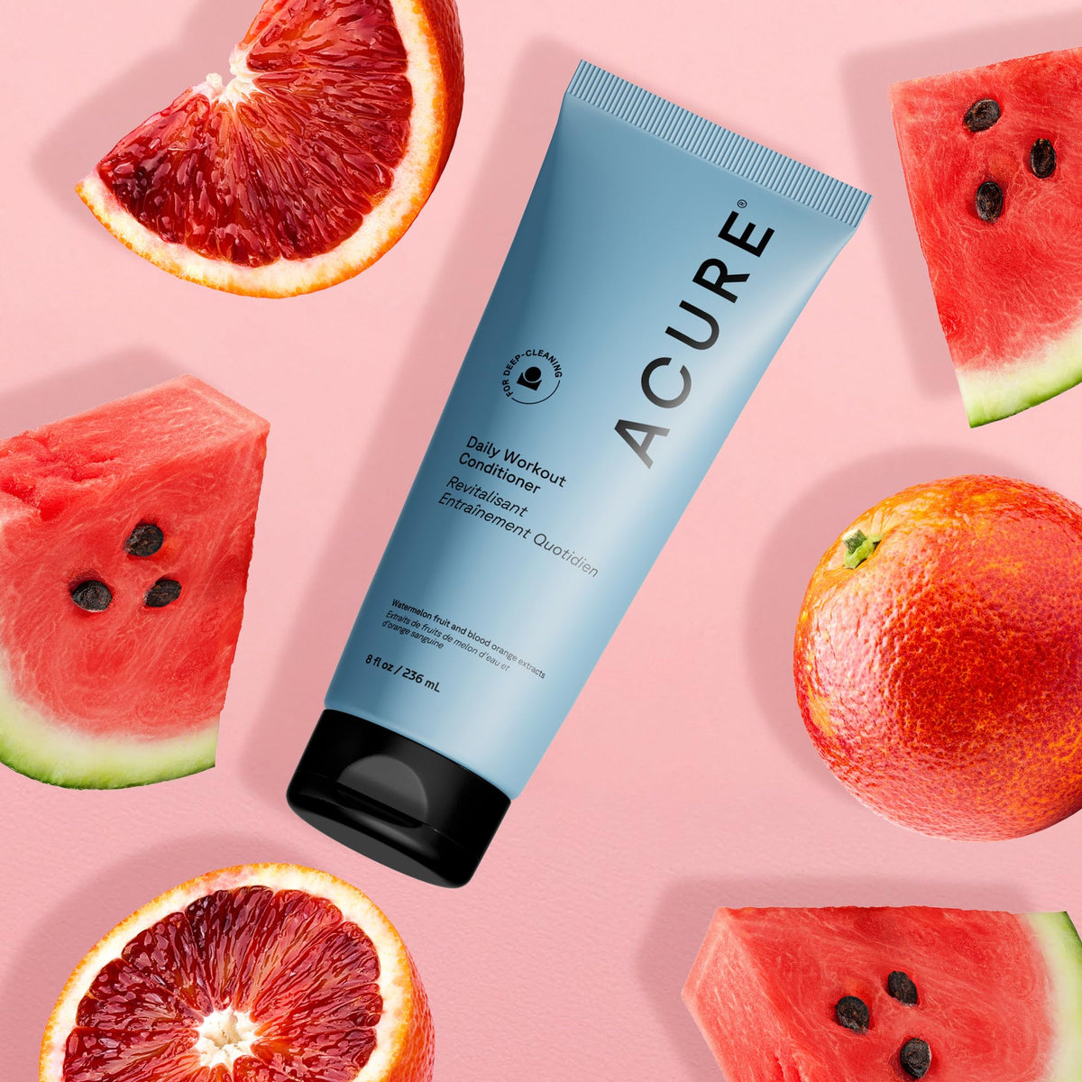 Acure Daily Workout Watermelon Conditioner applied to mid-lengths for easy daily nourishment