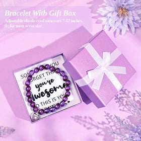 Adisher elegant gift card elevates a personal note inside the box.