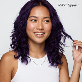 Applying Adore eggplant color on hair for smooth, even coverage.