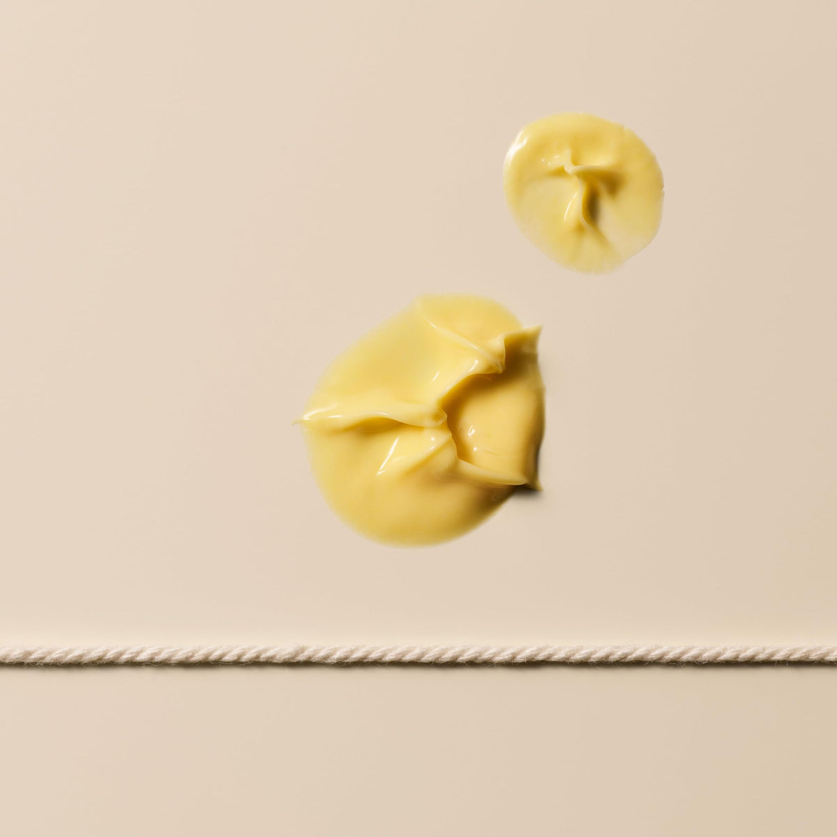 Aesop Camellia Nut Cream texture shown as soft matte layer for smooth skin