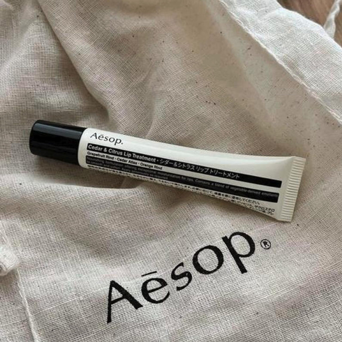 Aesop Cedar and Citrus Lip Balm packaging designed for effortless travel touch-ups