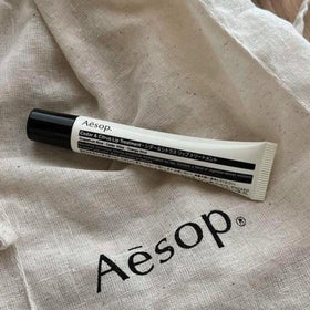 Aesop Cedar and Citrus Lip Balm packaging designed for effortless travel touch-ups