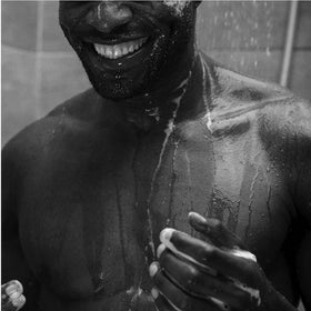 Applying Aesop conditioner refill to damp hair for softness