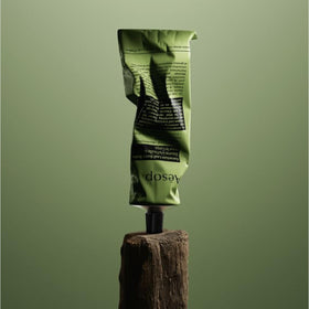 Dried elbows and knees being treated with Aesop Geranium Leaf Body Balm.