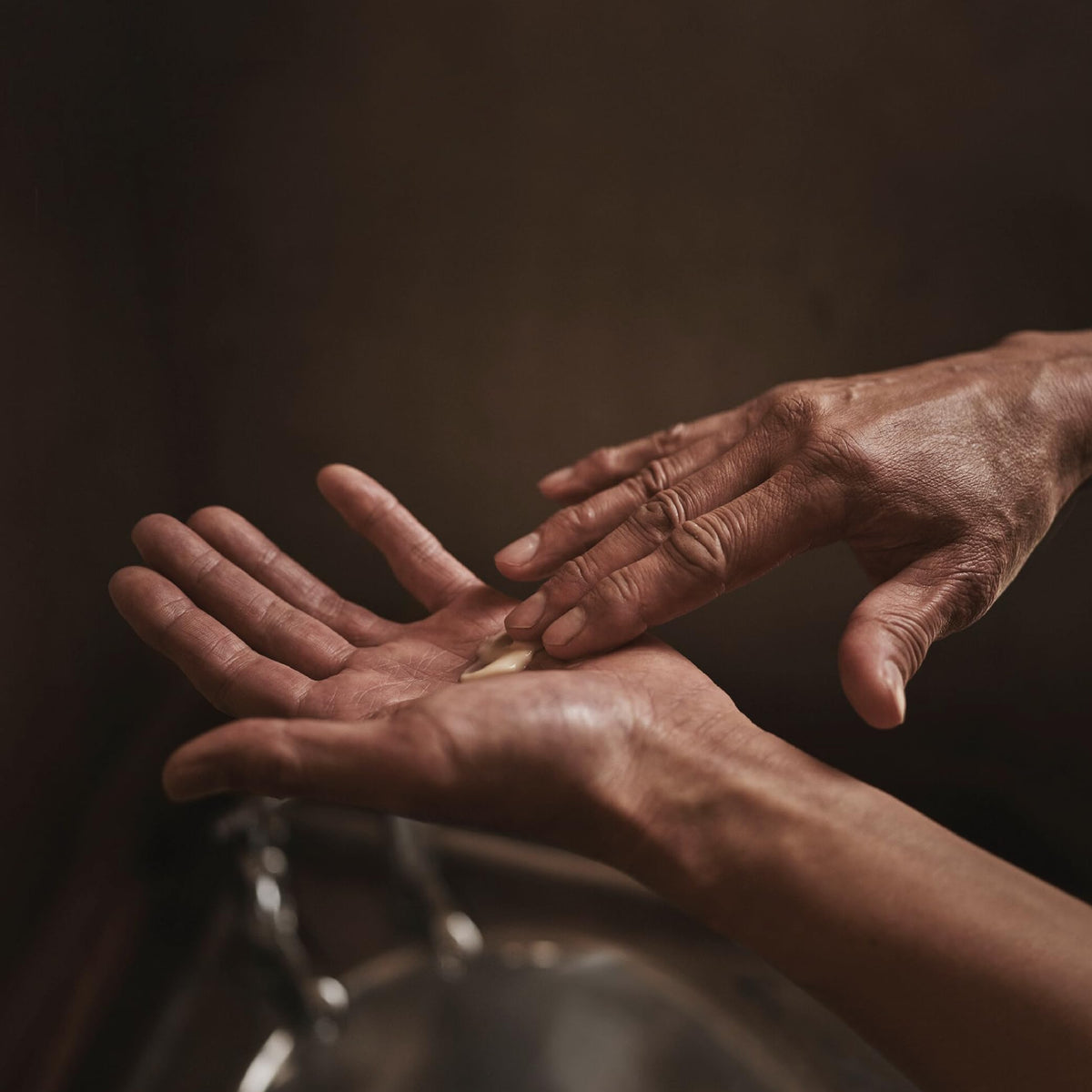 Aesop Rejuvenate Intensive Body Balm with macadamia oil ingredient highlight for hydration.