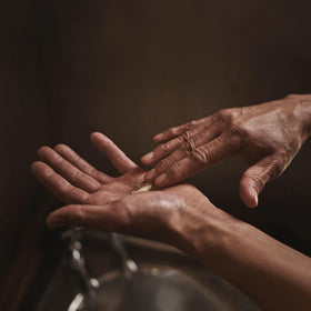 Aesop Rejuvenate Intensive Body Balm with macadamia oil ingredient highlight for hydration.