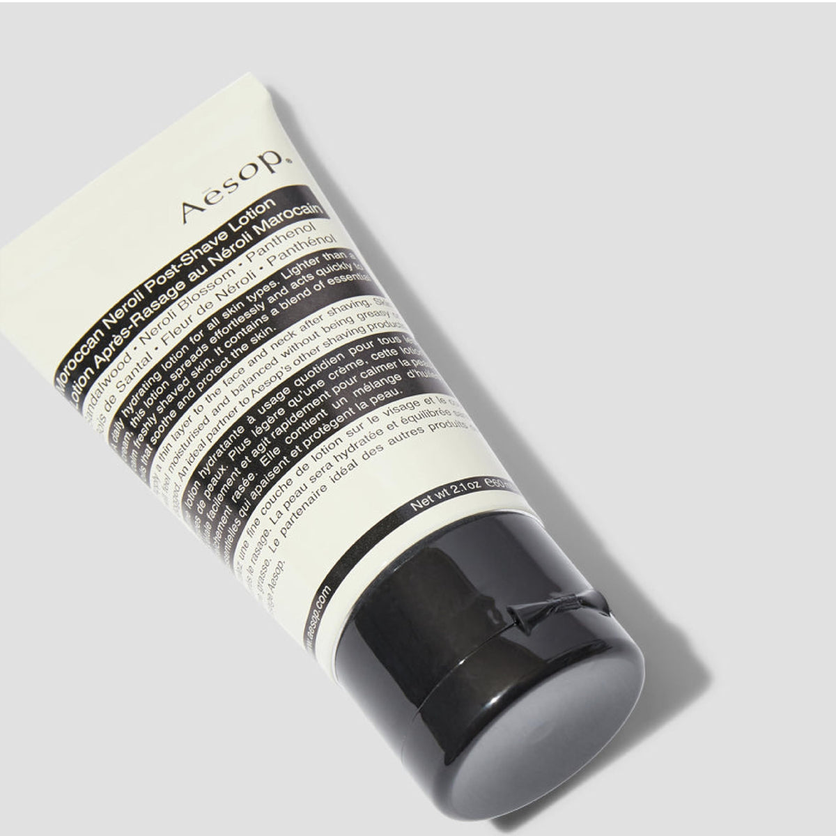 Close-up of the lotion texture shows a light, non-greasy finish.