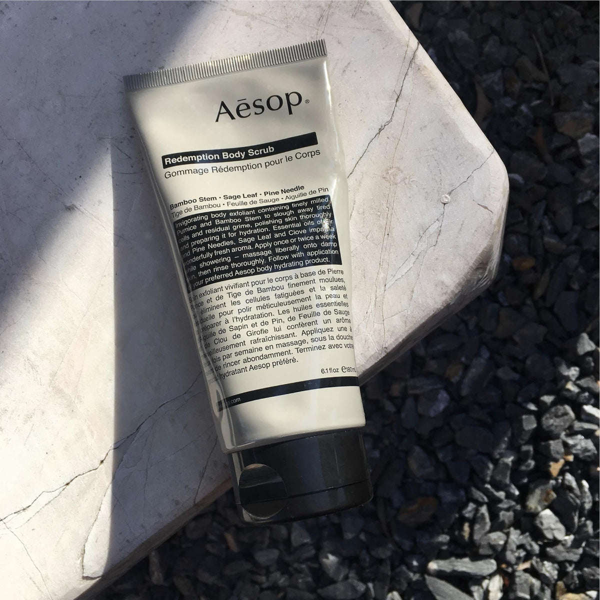 Aesop Redemption Body Scrub alpine-woody aroma evokes spa-like cleansing experience.