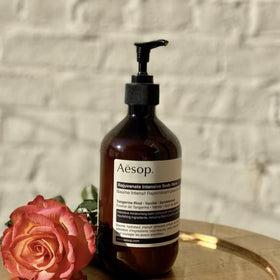 Aesop Rejuvenate Balm applied to elbows, knees, feet for smoother skin