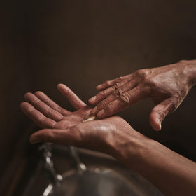 Packaging of Aesop Rejuvenate Balm with vegan, cruelty-free claim