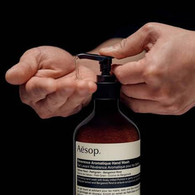 Aesop Reverence Hand Balm label close-up highlights Shea Butter and Macadamia Oil.