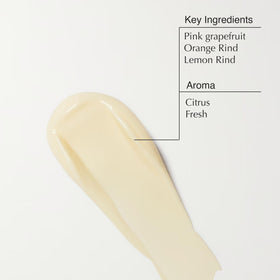 Hands massaging Aesop Rind Balm into freshly cleansed skin.