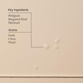 Aesop Tame Hair Serum close up highlighting petitgrain bergamot patchouli scent notes.