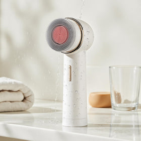AFEIOFT daily skincare routine with brush in sink setup.