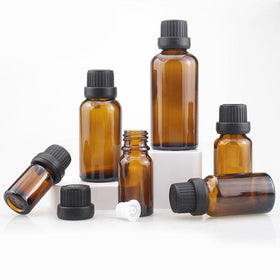 AFMNQZ amber glass bottle with orifice reducer enables precise dispensing.