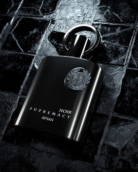 Afnan Supremacy Noir bottle on wooden surface ideal for daily wear