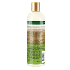 Applying Olive Miracle Leave-In to hair ends to help manage dryness.