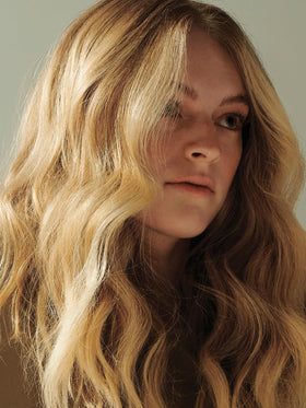 AG Care Sea Spray on damp hair delivering volumized, natural-looking waves and texture.