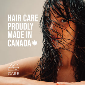 Close-up of hair being smoothed with The Oil for reduced frizz.